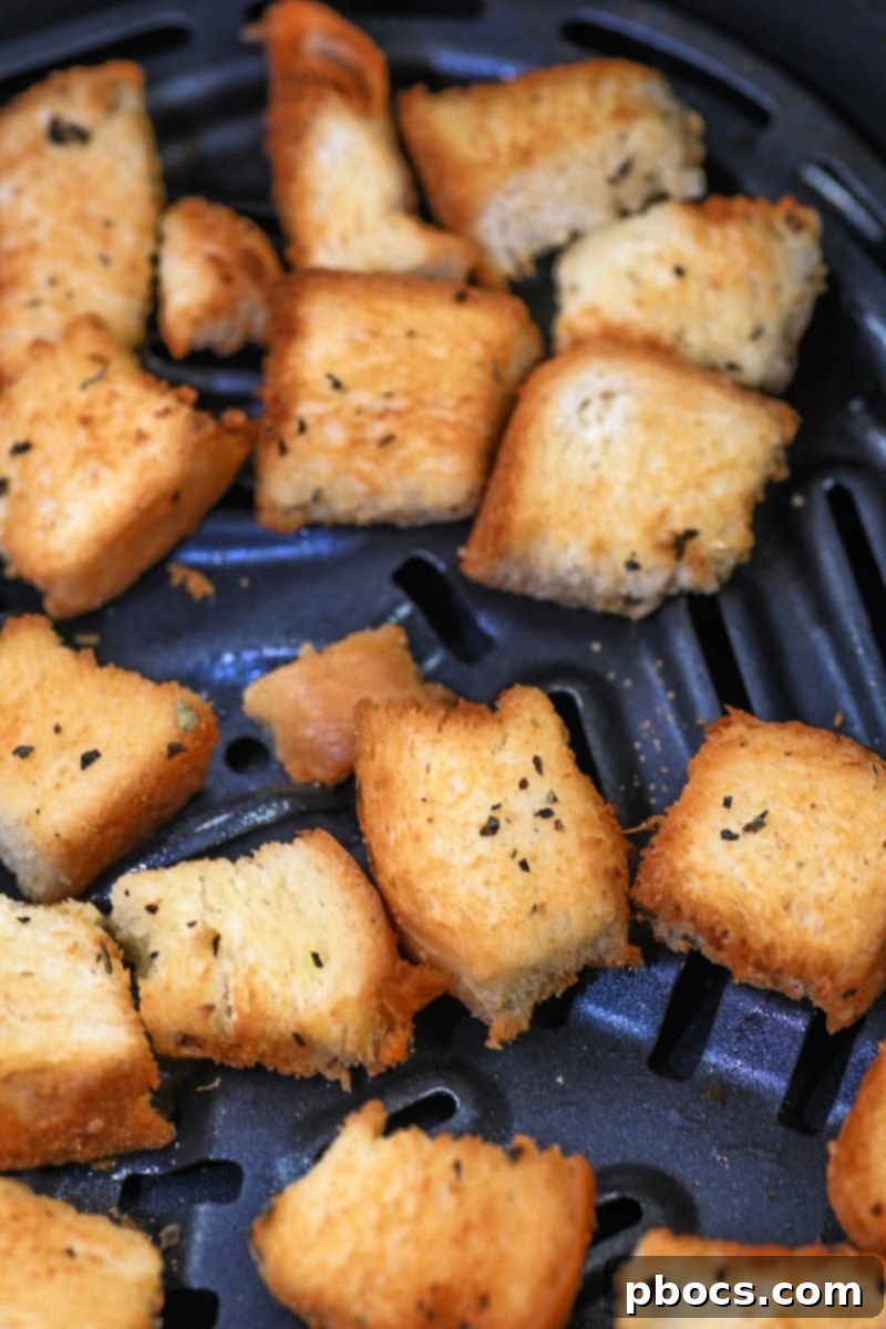 Keto Broccoli Caesar Crunch 9 Keto bread cubes tossed with olive oil and spices, ready for air frying