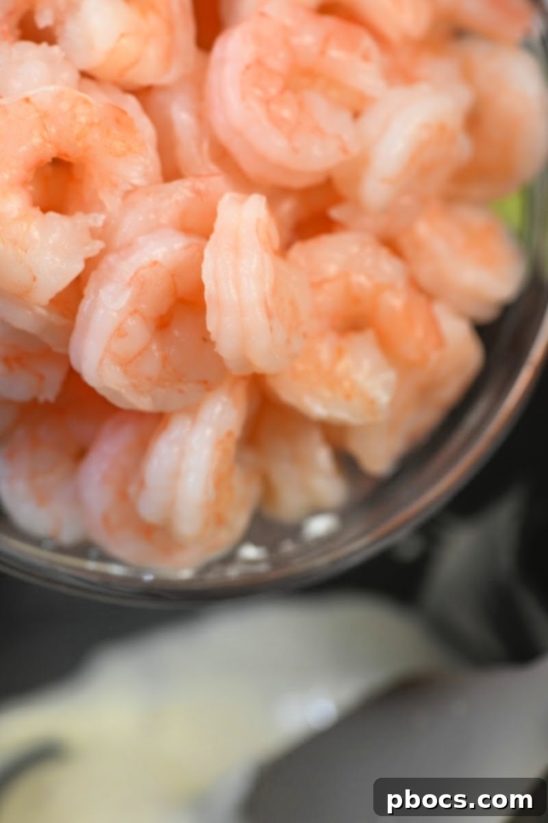 Cooked shrimp in a mixing bowl
