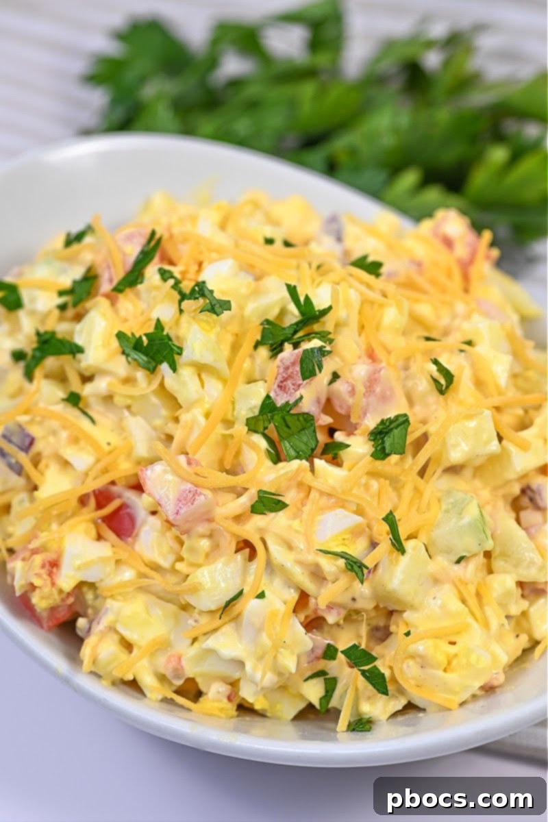 Keto Tomato Egg Salad Garnished with Shredded Cheese