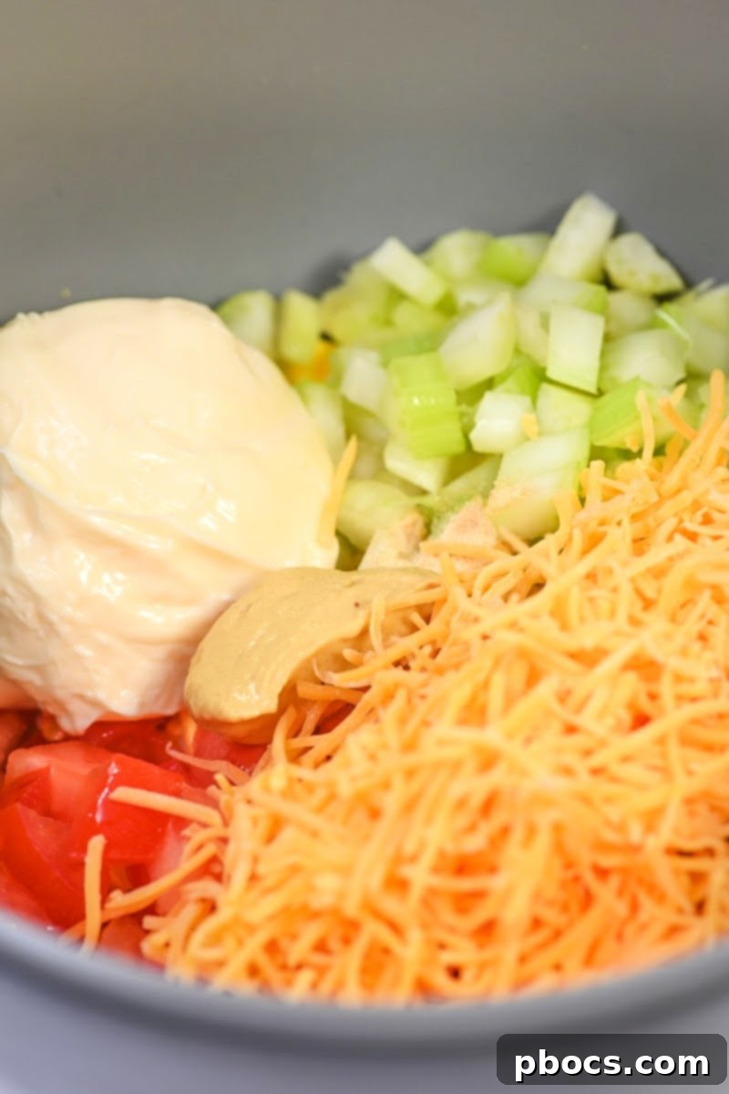 Mixing the ingredients for the egg salad in a bowl