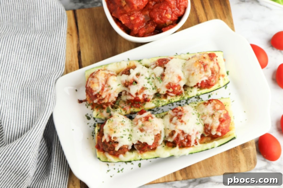 Baked Low-Carb Meatball Zucchini Boats with melted mozzarella