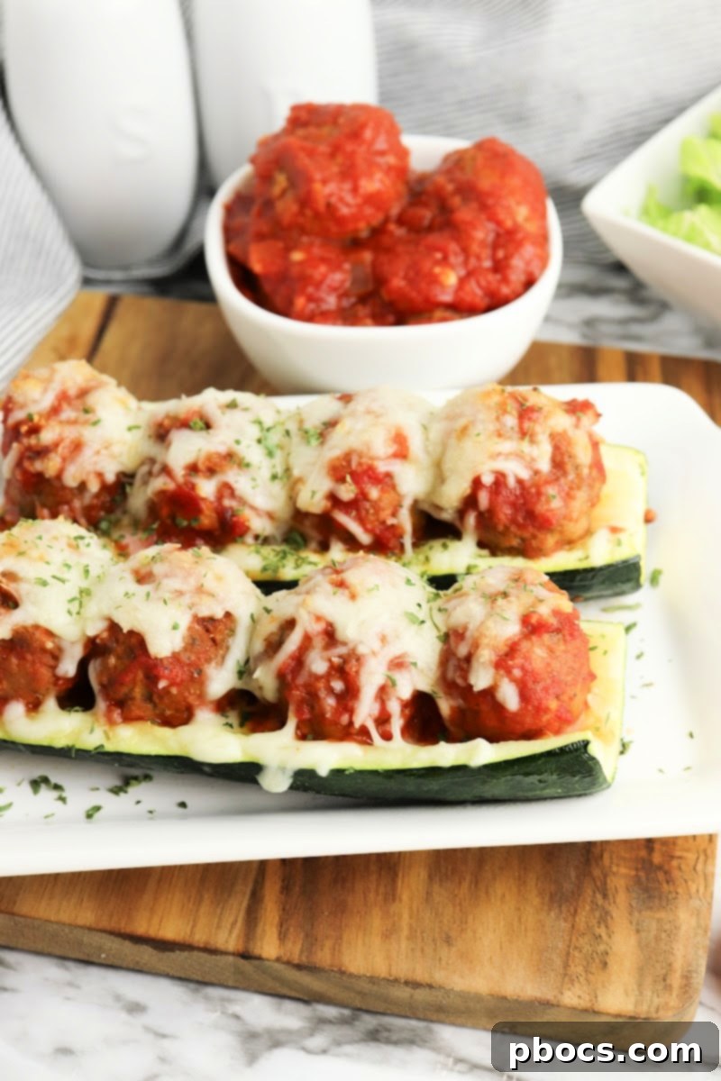 Low-Carb Meatball Zucchini Boats served with side dishes