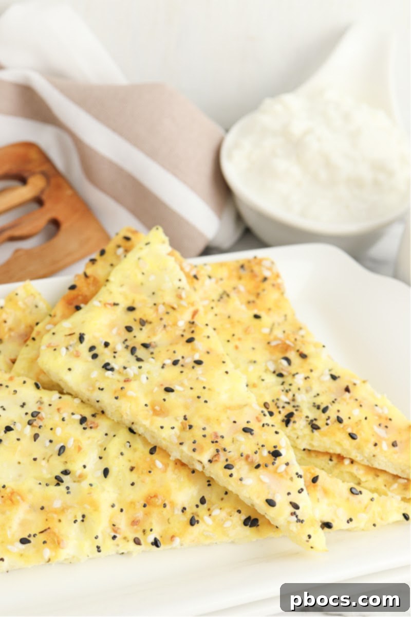 Golden-brown Keto Cottage Cheese Flatbread on parchment paper