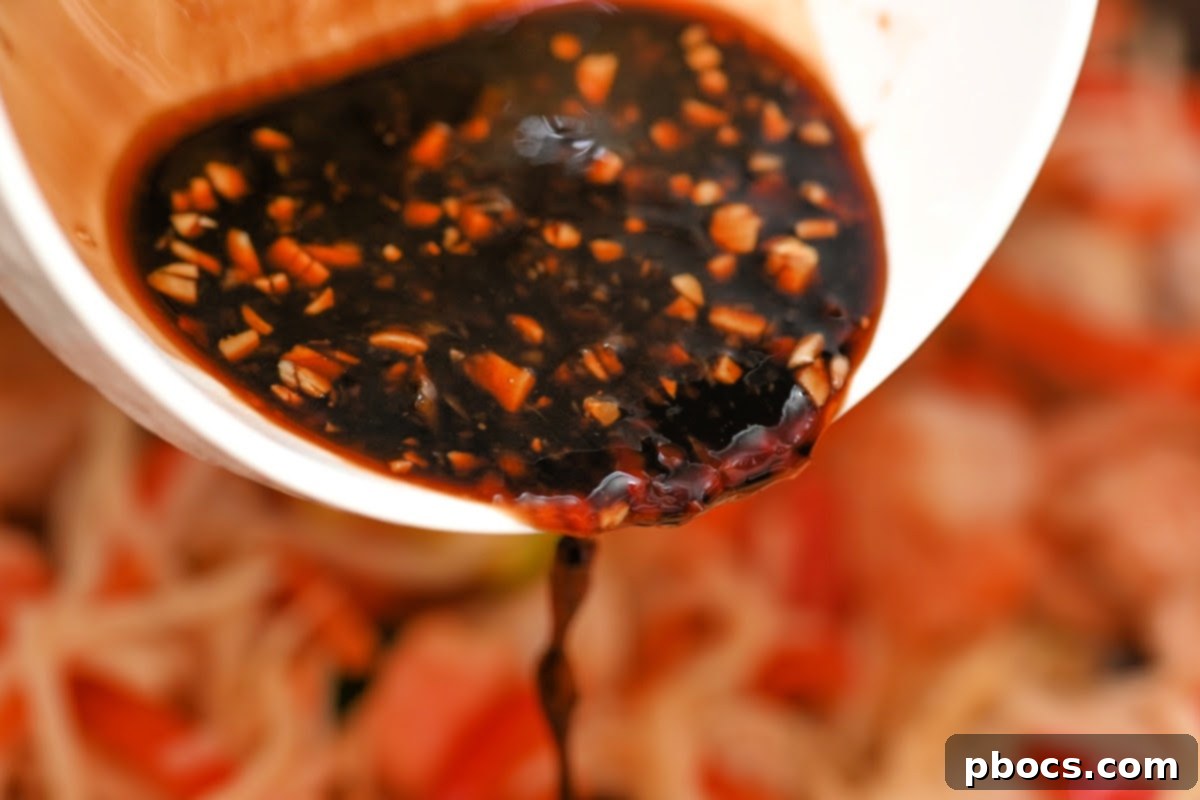 Adding the sauce to the noodles