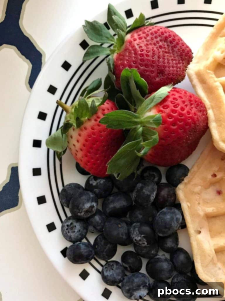 Bowls of fresh fruit and cereal for waffle cake