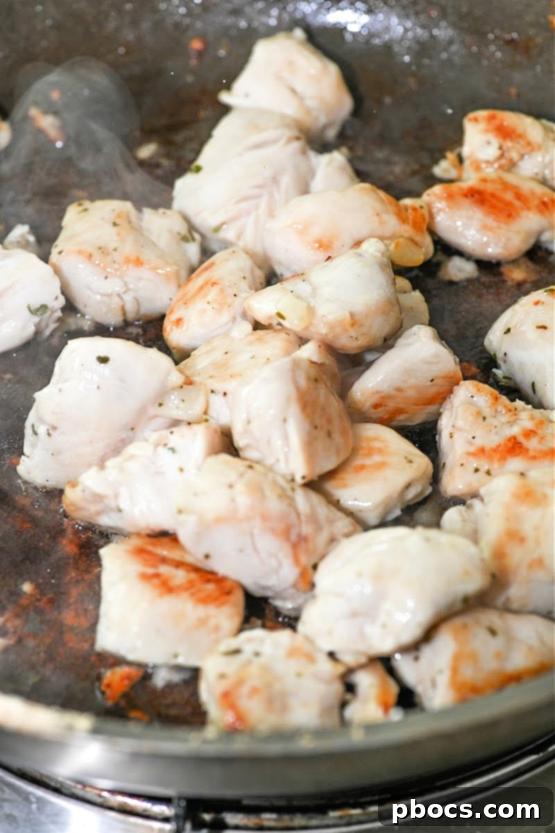 One Pan Keto BBQ Ranch Chicken 9 Cooking Chicken in a skillet