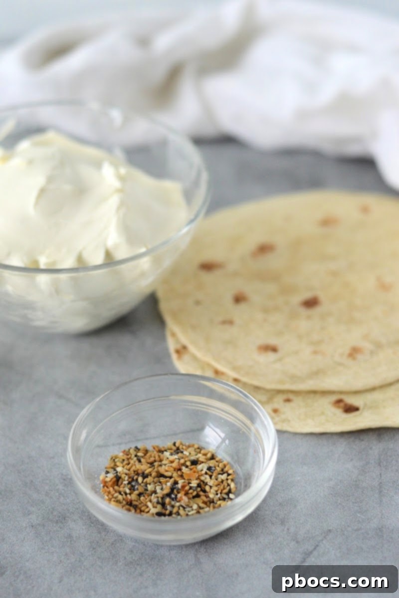 Keto Cream Cheese Bagel Poppers 8 All ingredients for Keto Cream Cheese Bagel Bites: low-carb tortillas, cream cheese, and Everything Bagel Seasoning.