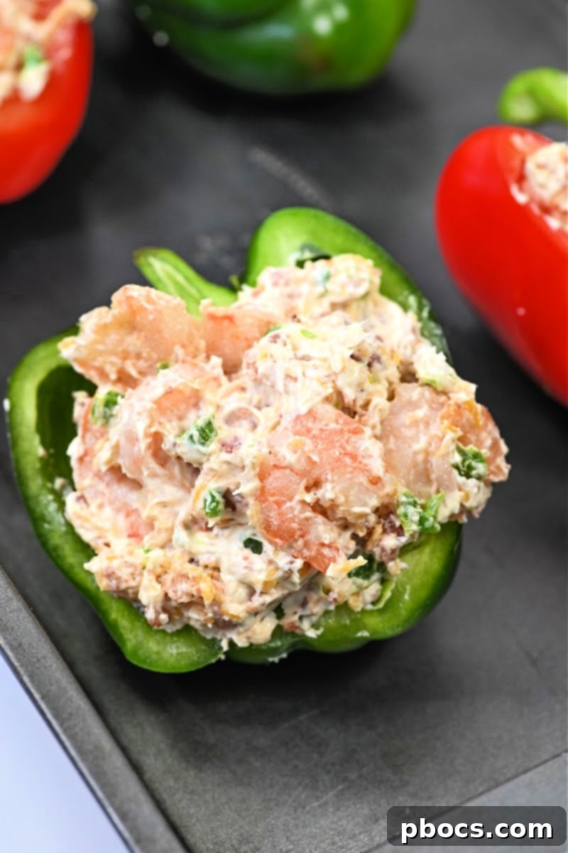 Adding the stuffing to the bell peppers