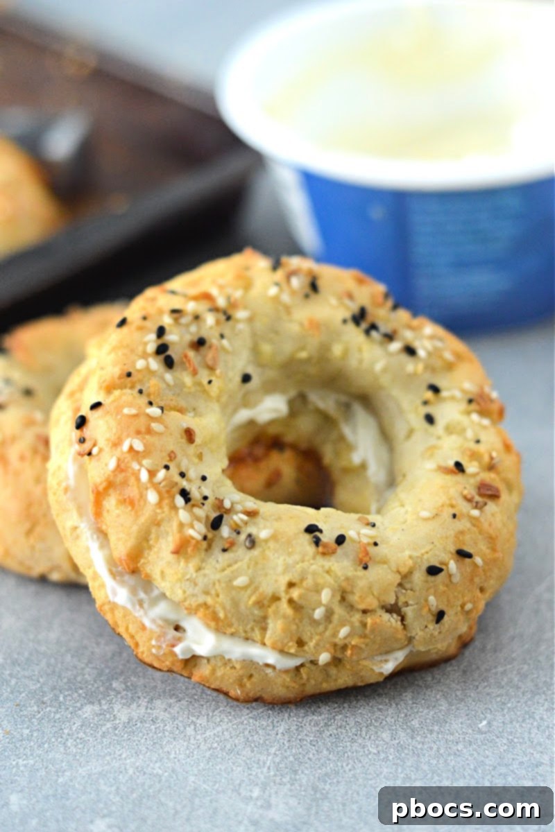 Golden brown Keto Cottage Cheese Bagels on a baking sheet, ready to be enjoyed.