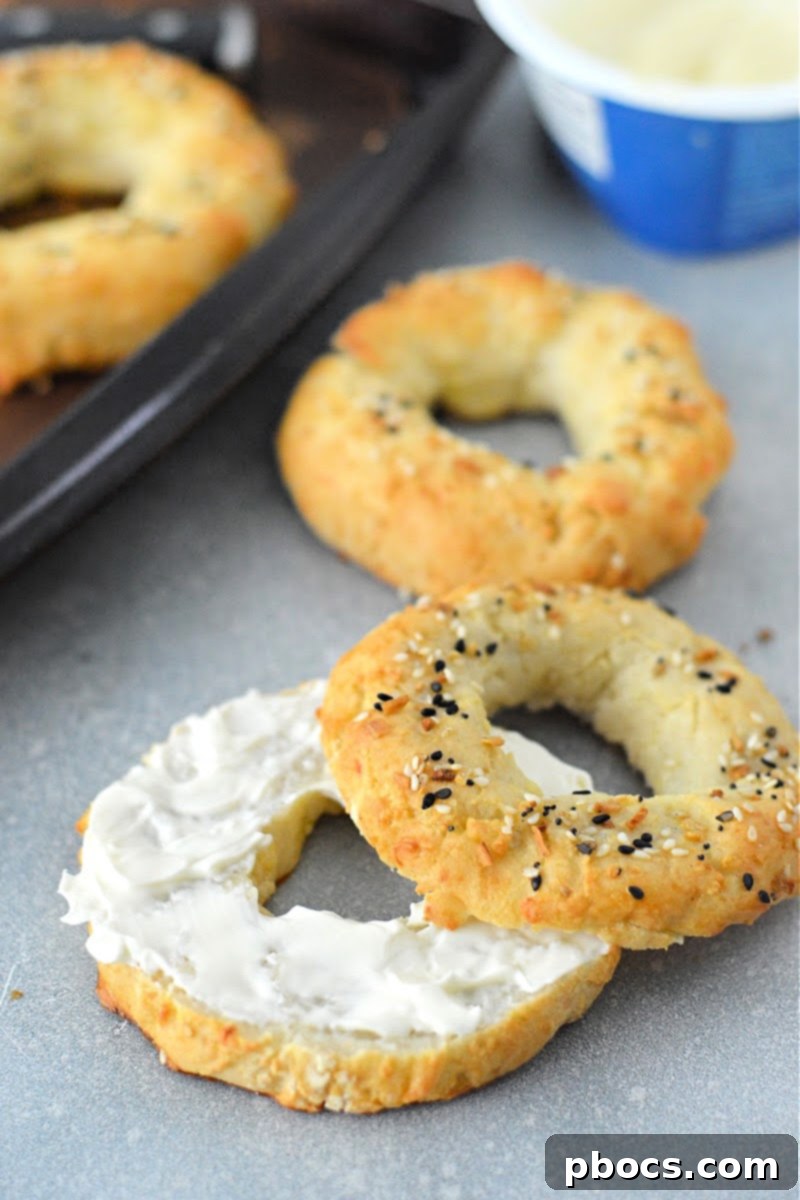 Close-up of a sliced Keto Cottage Cheese Bagel revealing its fluffy interior.