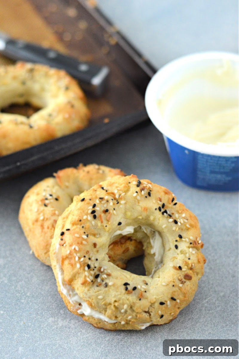 Freshly baked Keto Cottage Cheese Bagels cooling on a wire rack.