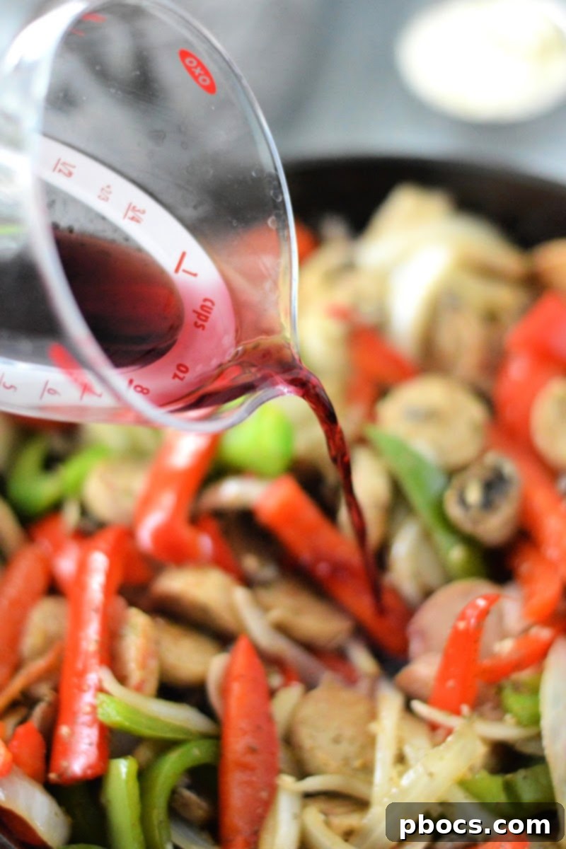 Adding Garlic, Seasoning, and Wine for Flavor Development