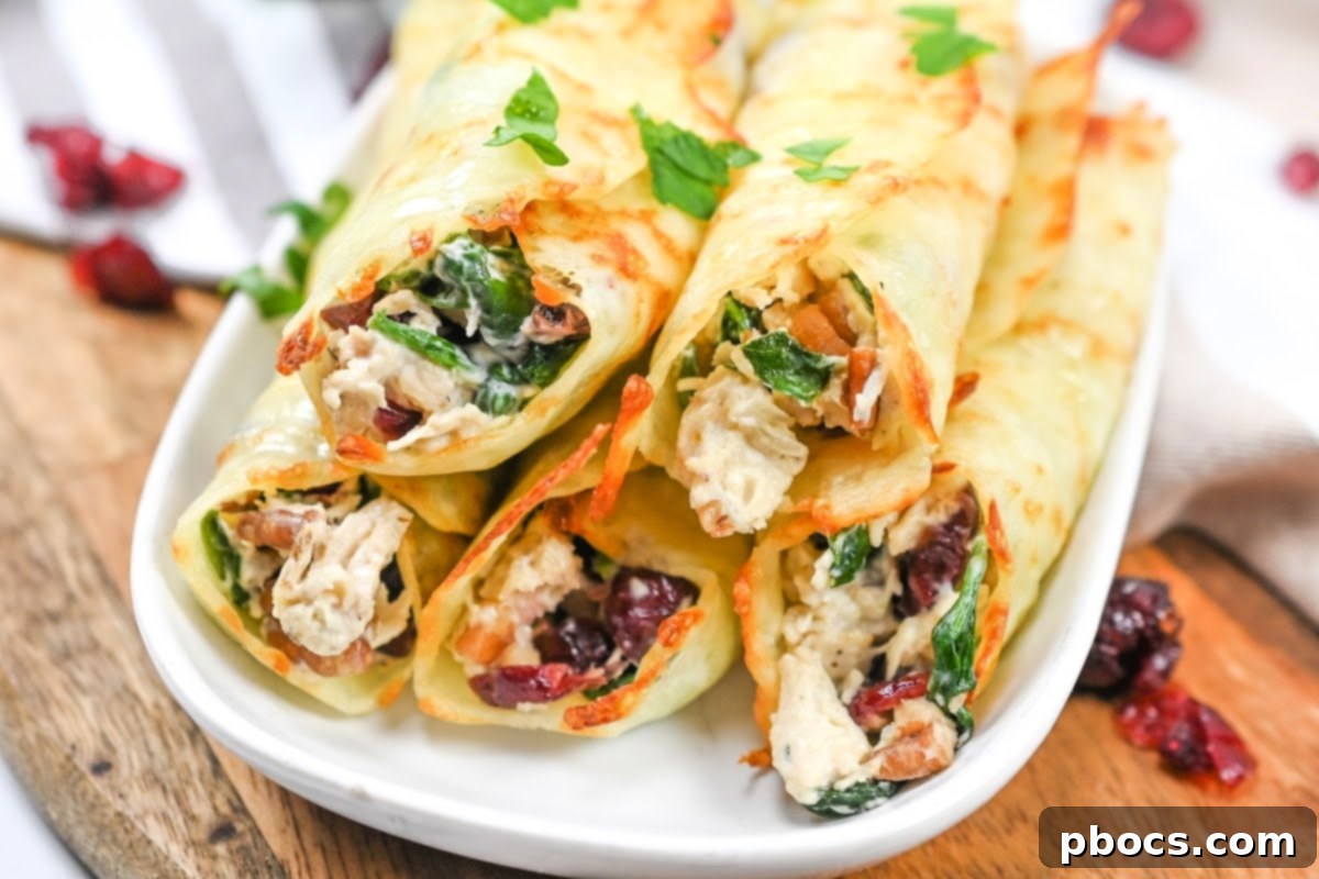 Close-up of a Cranberry Pecan Chicken Roll-Up, showcasing the vibrant cranberries