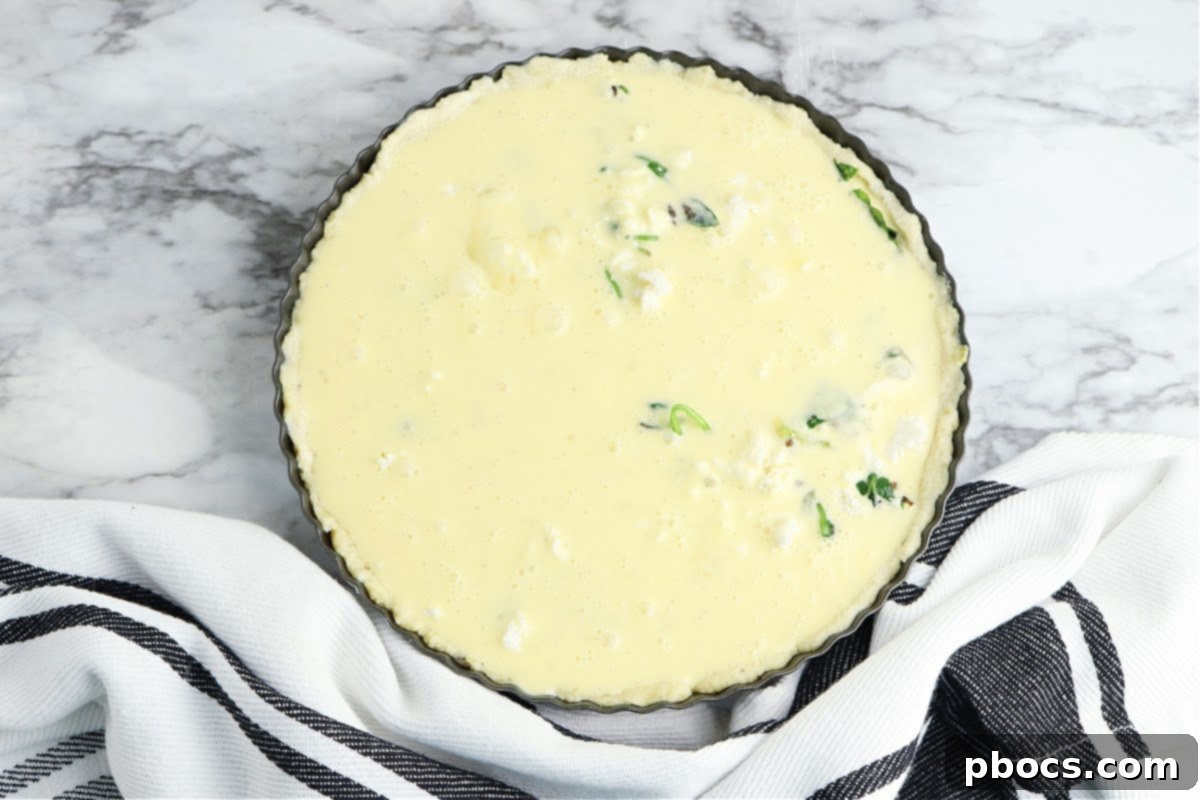 Mediterranean Keto Spinach Feta Bake 14 Unbaked quiche, ready for the oven.