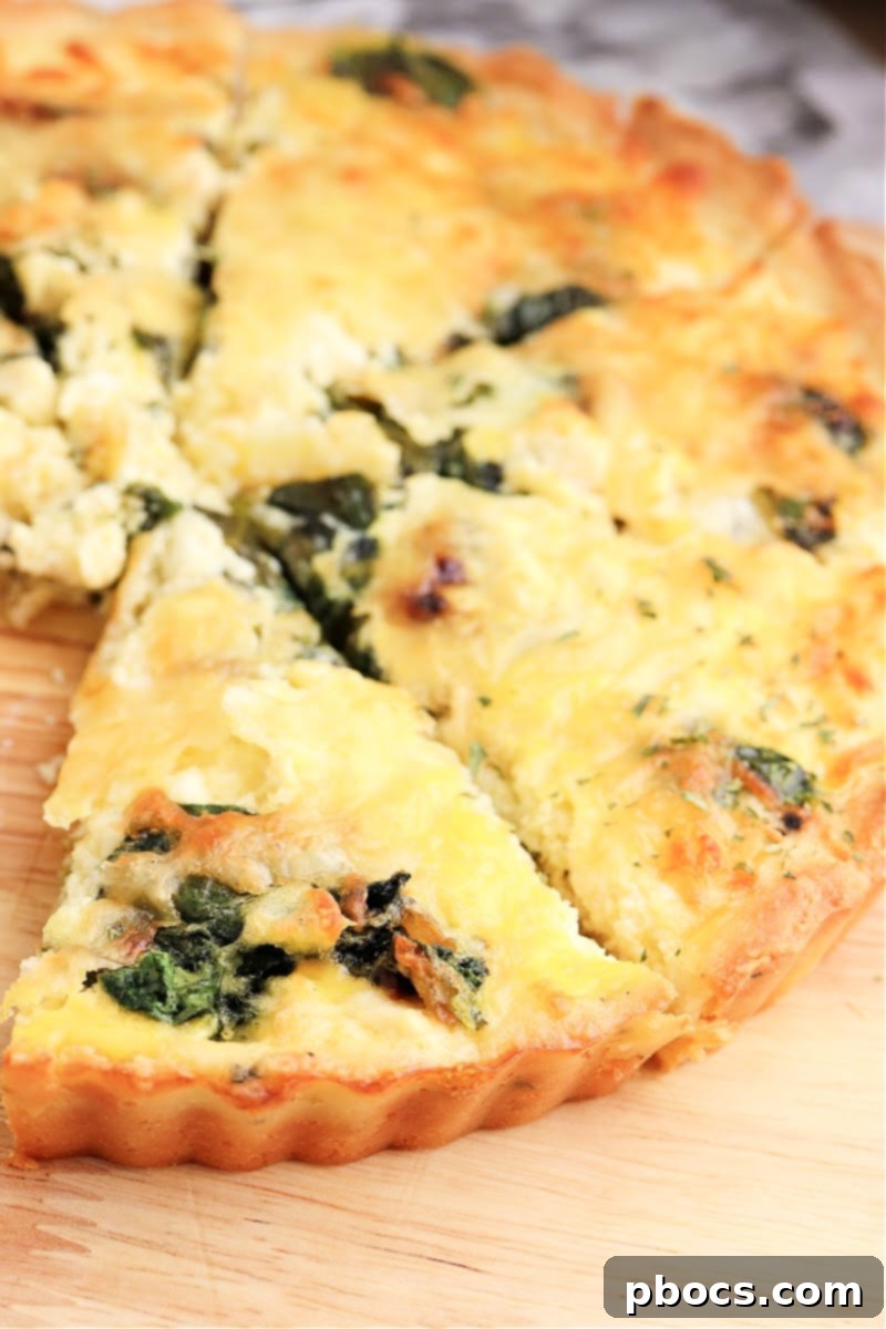 Mediterranean Keto Spinach Feta Bake 3 Closeup of a freshly baked Keto Spinach Feta Quiche slice.