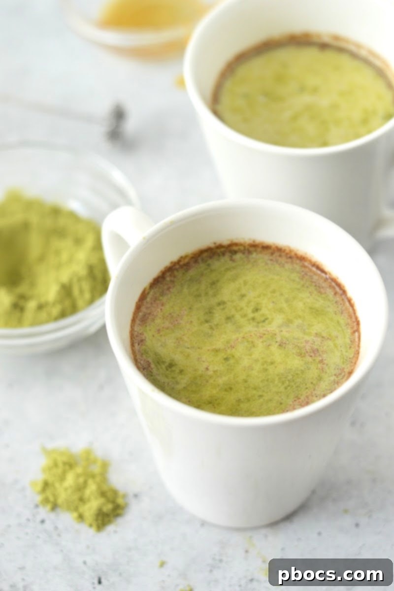 Keto Pumpkin Matcha Latte, a vibrant green and orange drink for fall
