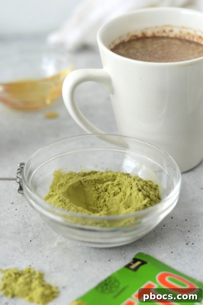 Close-up of a warm Keto Pumpkin Matcha Latte in a mug