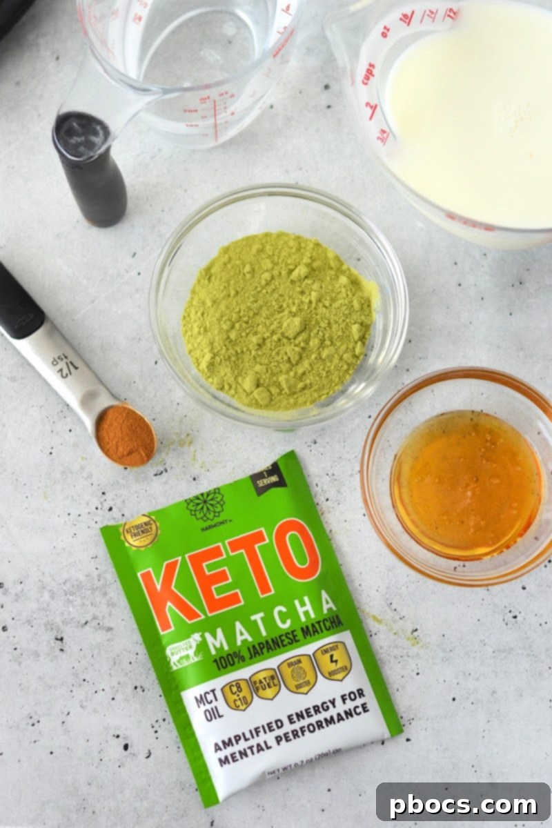 A mug of Keto Pumpkin Matcha topped with spices and garnished