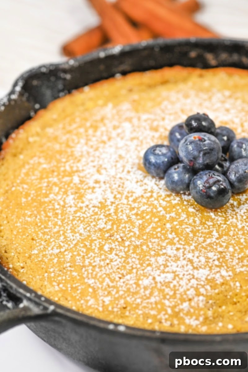 Keto Pumpkin Spice Dutch Baby baking in the oven