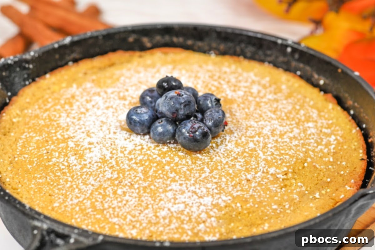 Finished Keto Pumpkin Spice Dutch Baby dusted with powdered Swerve