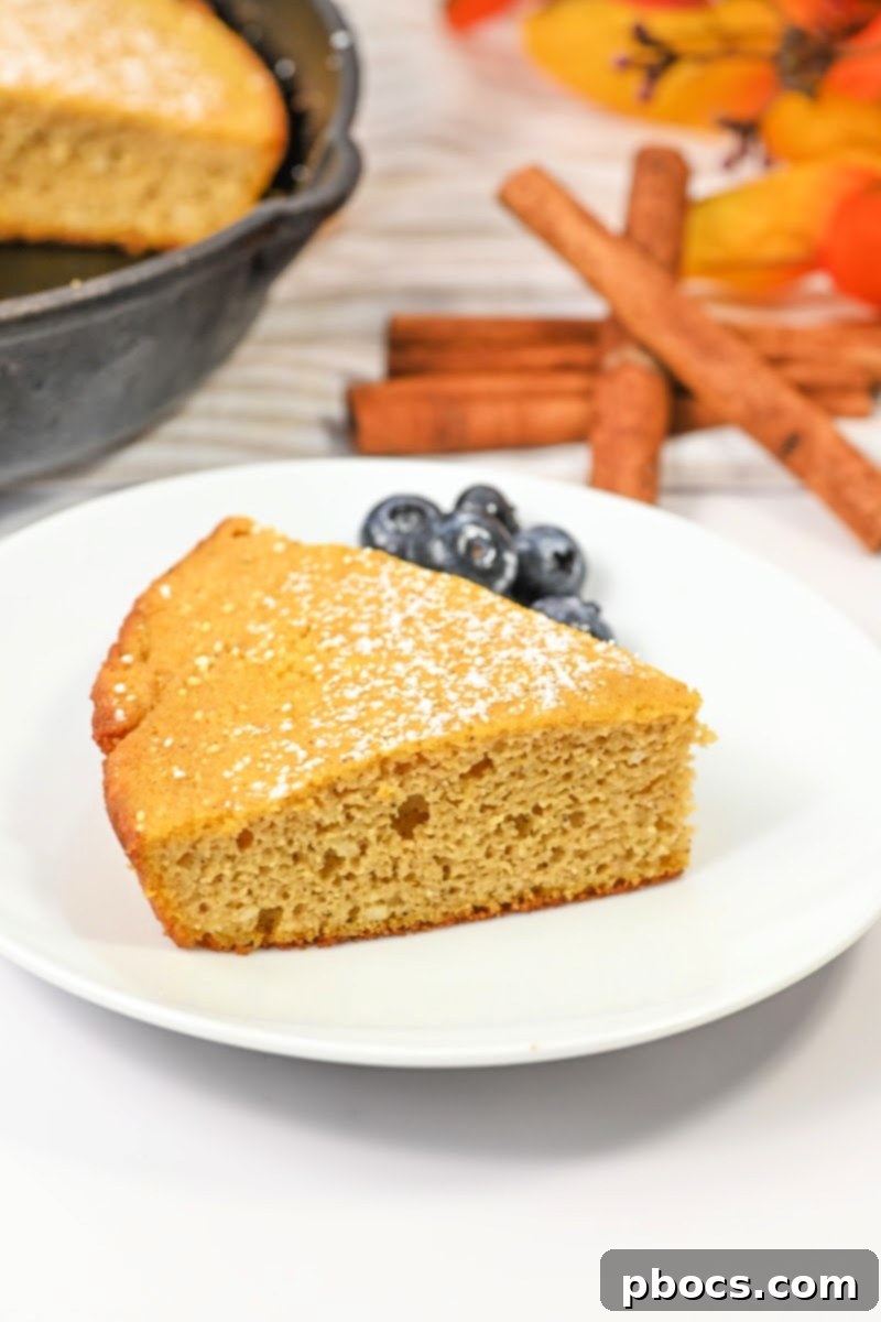Classic Dutch Baby pancake puffing up in a cast iron skillet