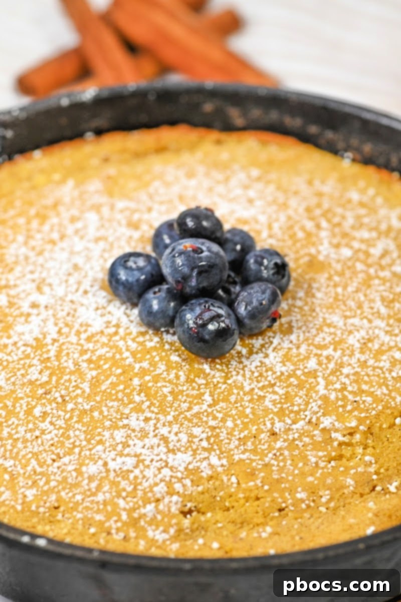 Serving a slice of Keto Pumpkin Spice Dutch Baby