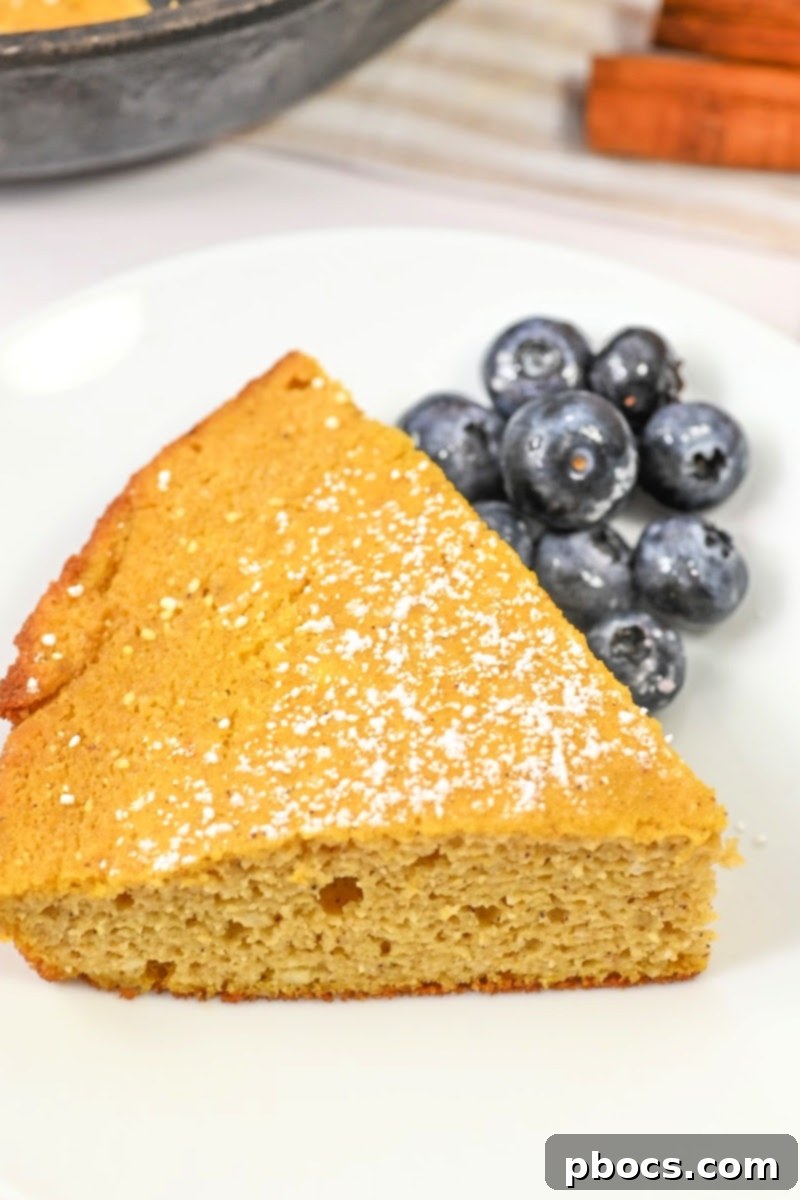 Keto Pumpkin Spice Dutch Baby served with a side of berries