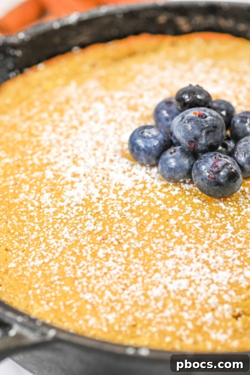 Keto Pumpkin Spice Dutch Baby slices stored in an airtight container