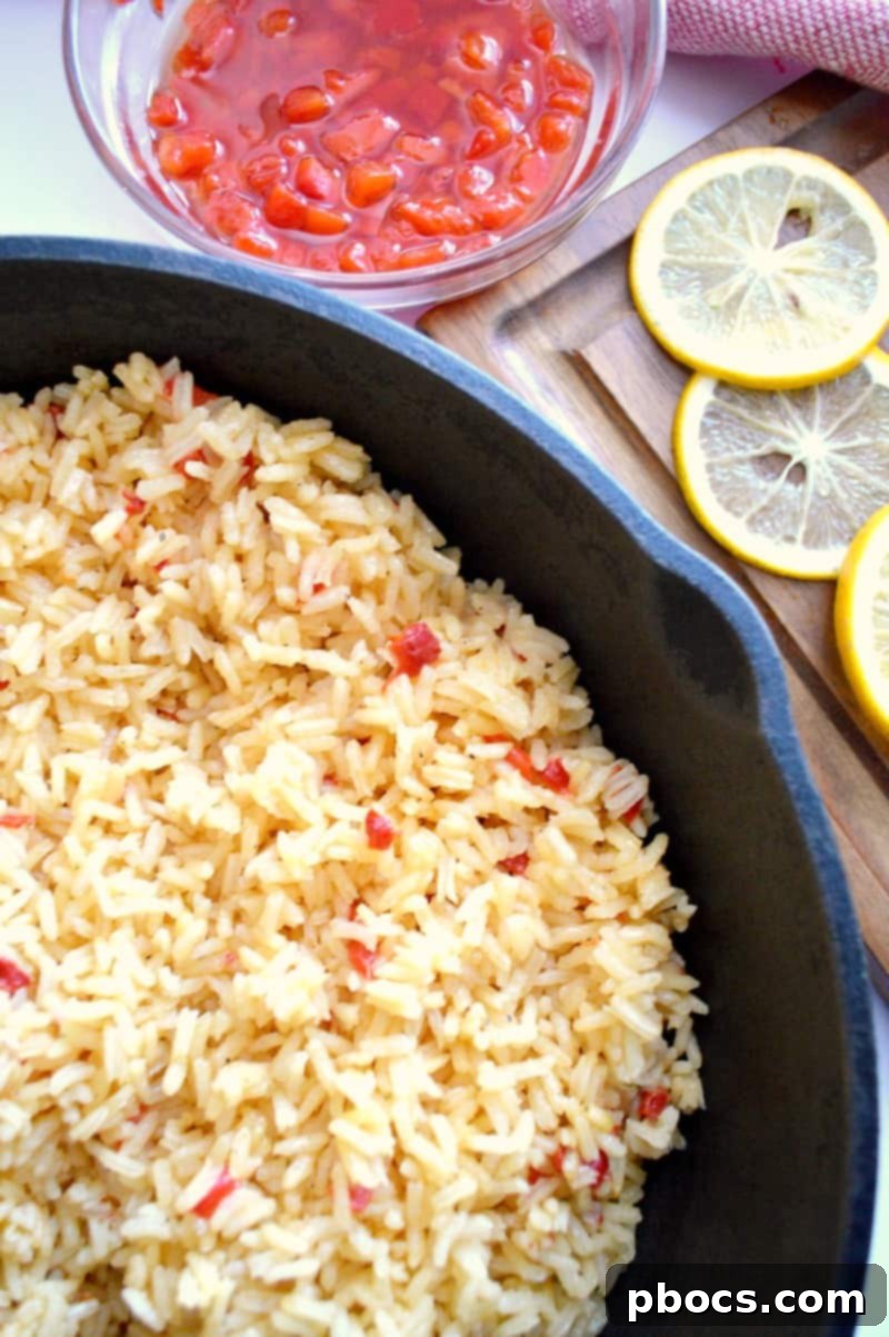Cooked Red Pepper & Lemon Rice garnished with fresh dill.