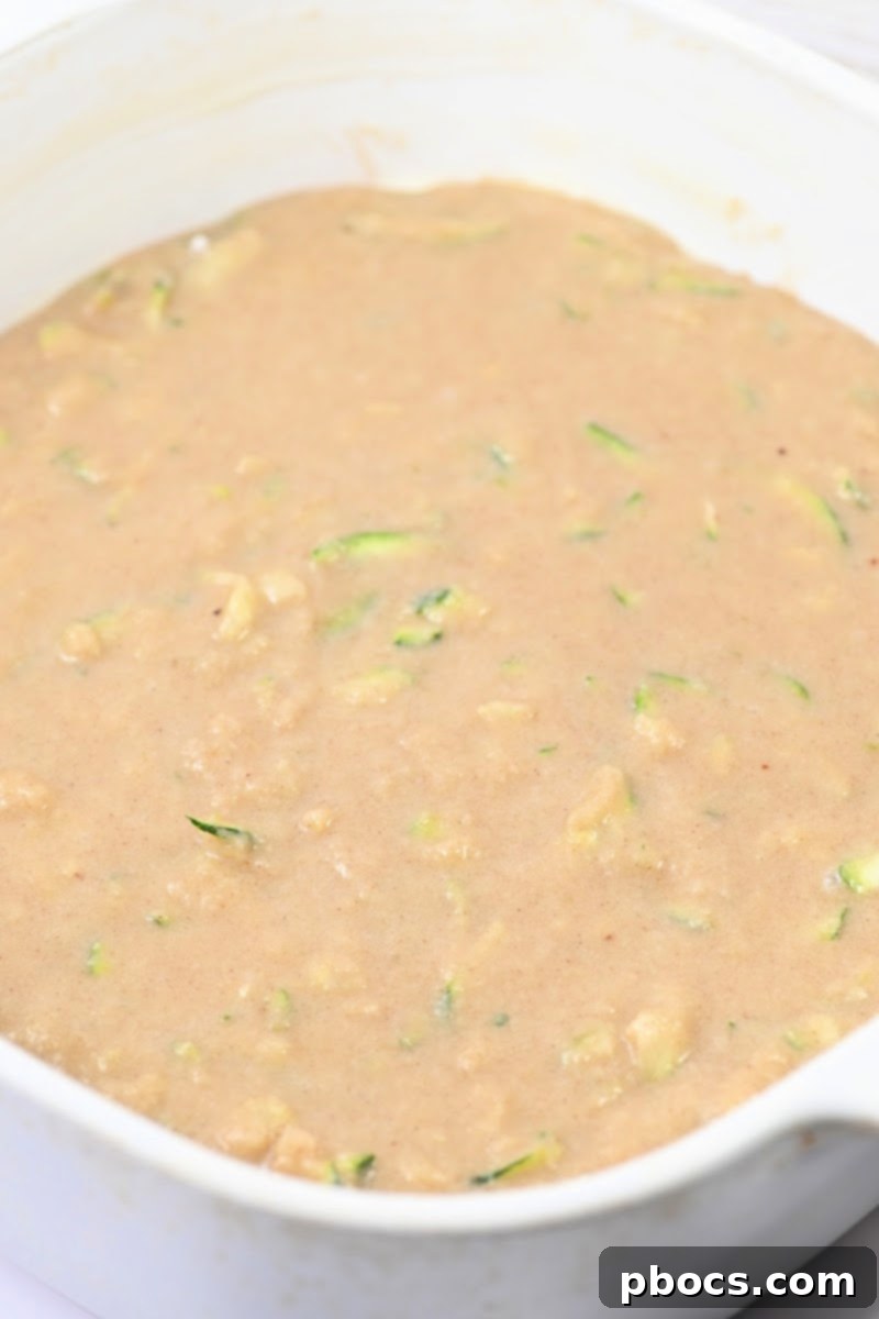 Decadent Keto Cinnamon Brown Sugar Zucchini Cake 10 Unbaked keto cake batter in a 9x9 casserole dish