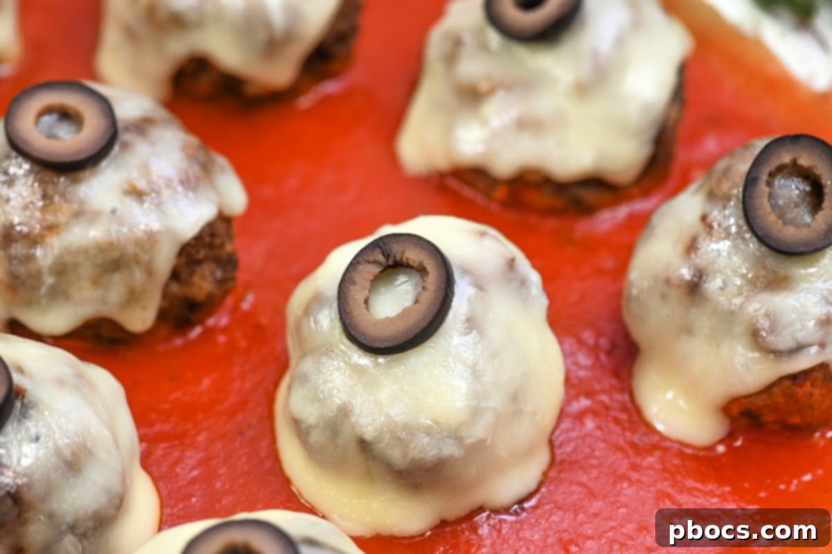 Batch of raw Keto Meatballs, perfectly formed and ready for cooking