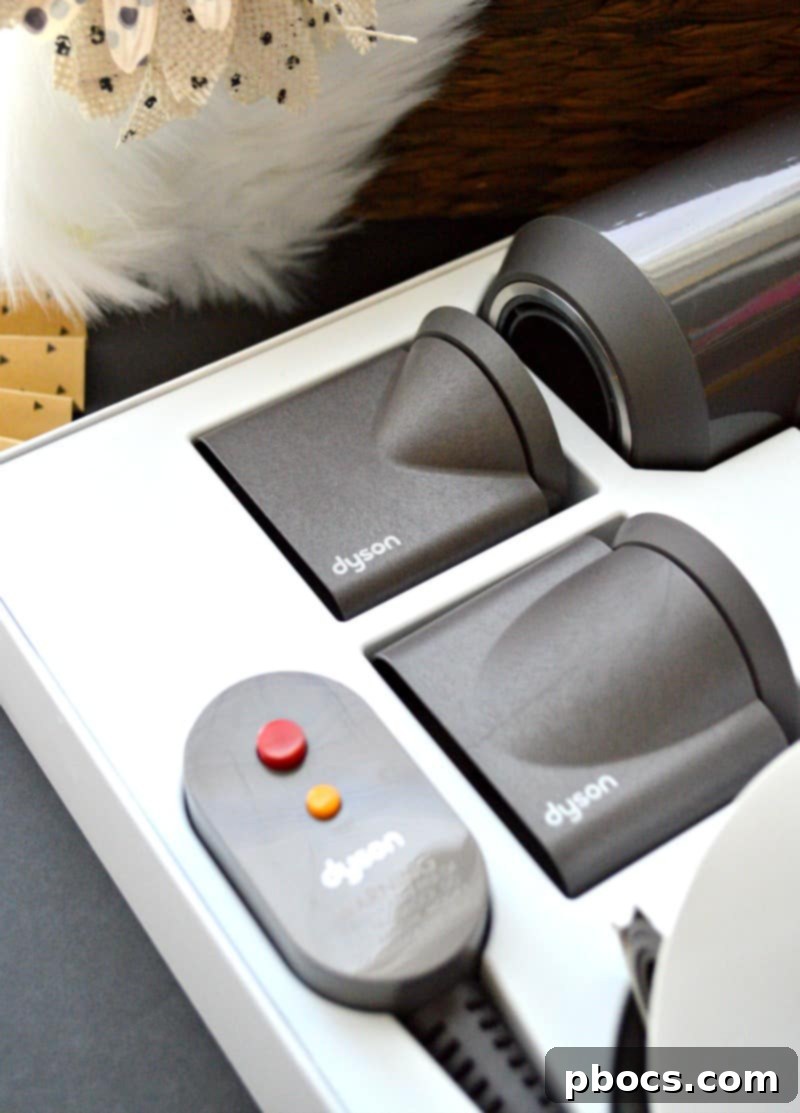 Dyson Supersonic: The Future of Hair Styling 2 Dyson Supersonic Hair Dryer in use, showcasing sleek design