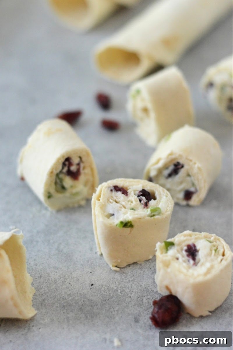 Delicious Low-Carb Cranberry Cream Cheese Pinwheels arranged on a platter, ready to serve.