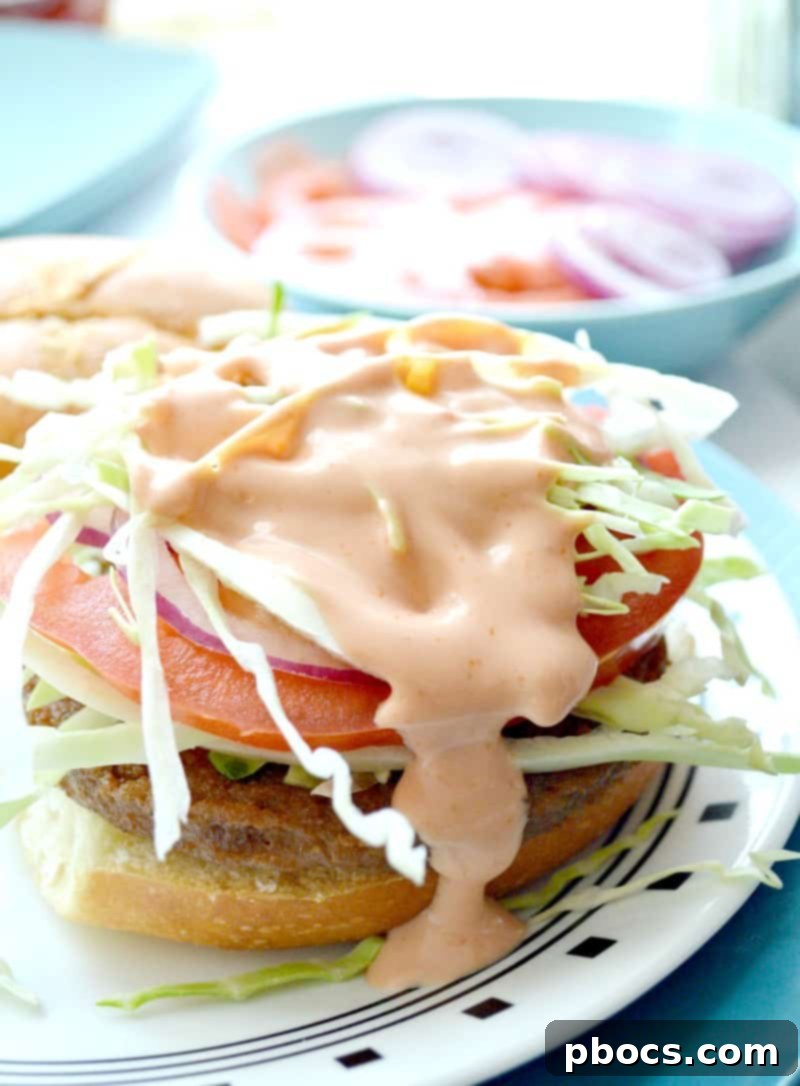 Finished vegetarian Chimi Dominican burger, topped with special sauce and ready to eat