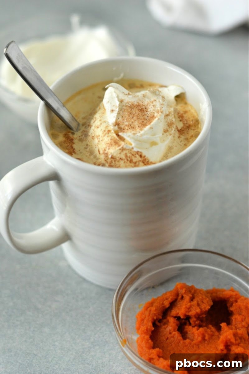 Close-up of a Low-Carb Pumpkin Spice Latte with a generous dollop of whipped cream