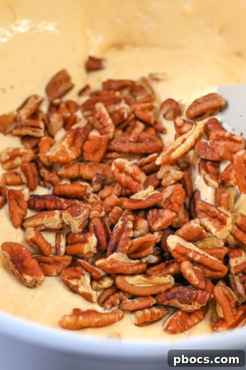 Adding pecans to the batter