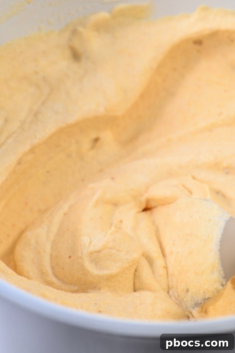 Guilt-Free Pumpkin Spice Ice Cream 9 Mixing bowl with heavy whipping cream, Swerve, and almond milk