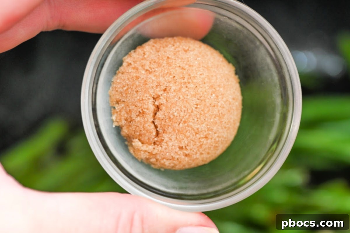 One-Pan Keto Honey-Glazed Ham and Green Beans 11 Adding Swerve Brown Sugar Substitute to green beans