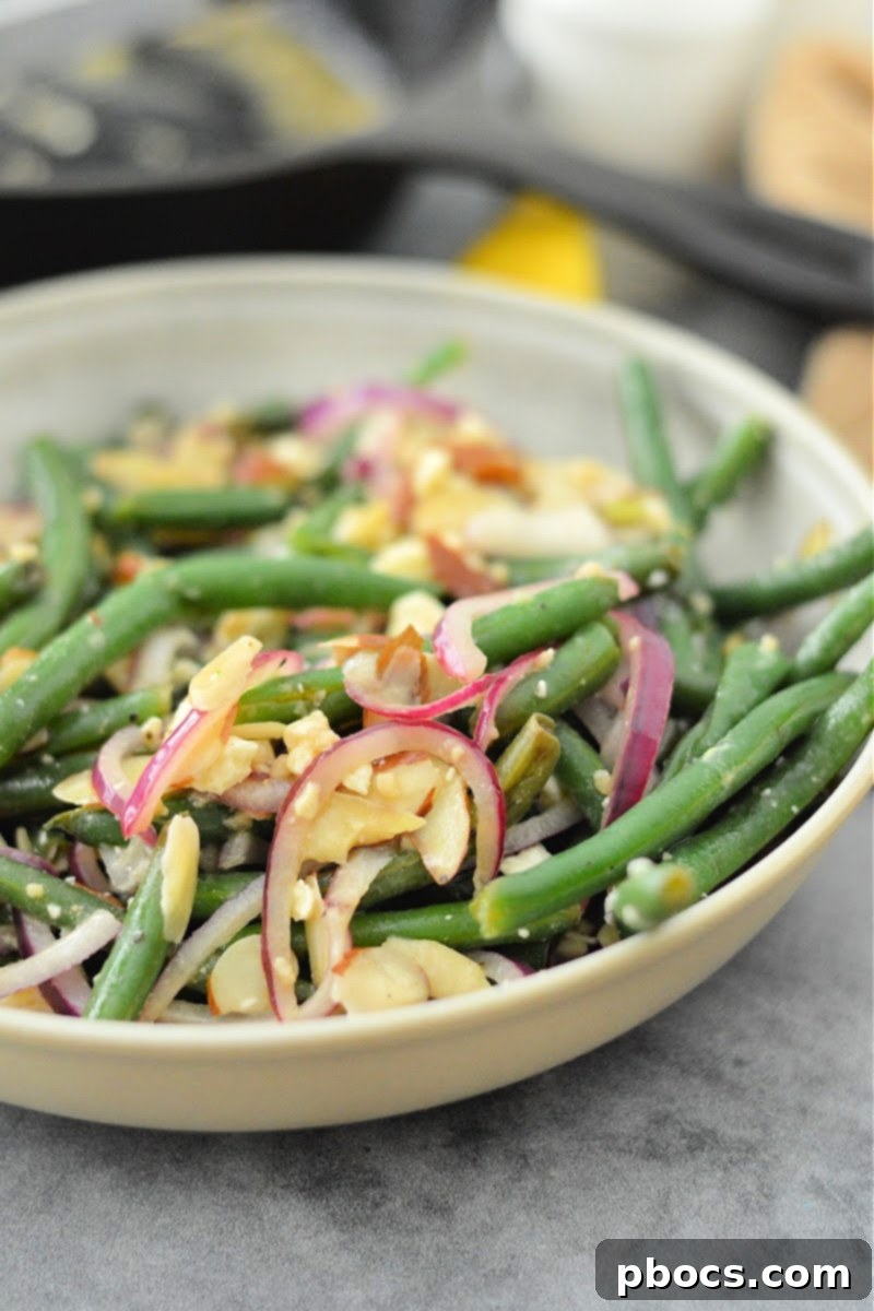 Warm Keto Green Bean Salad with Toasted Almonds 11 Keto Warm Green Bean Salad With Almonds - final step with feta cheese