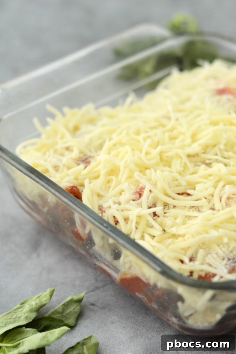 Keto Chicken Parmesan Nugget Bake 13 Shredded parmesan and mozzarella cheese sprinkled over the unbaked casserole