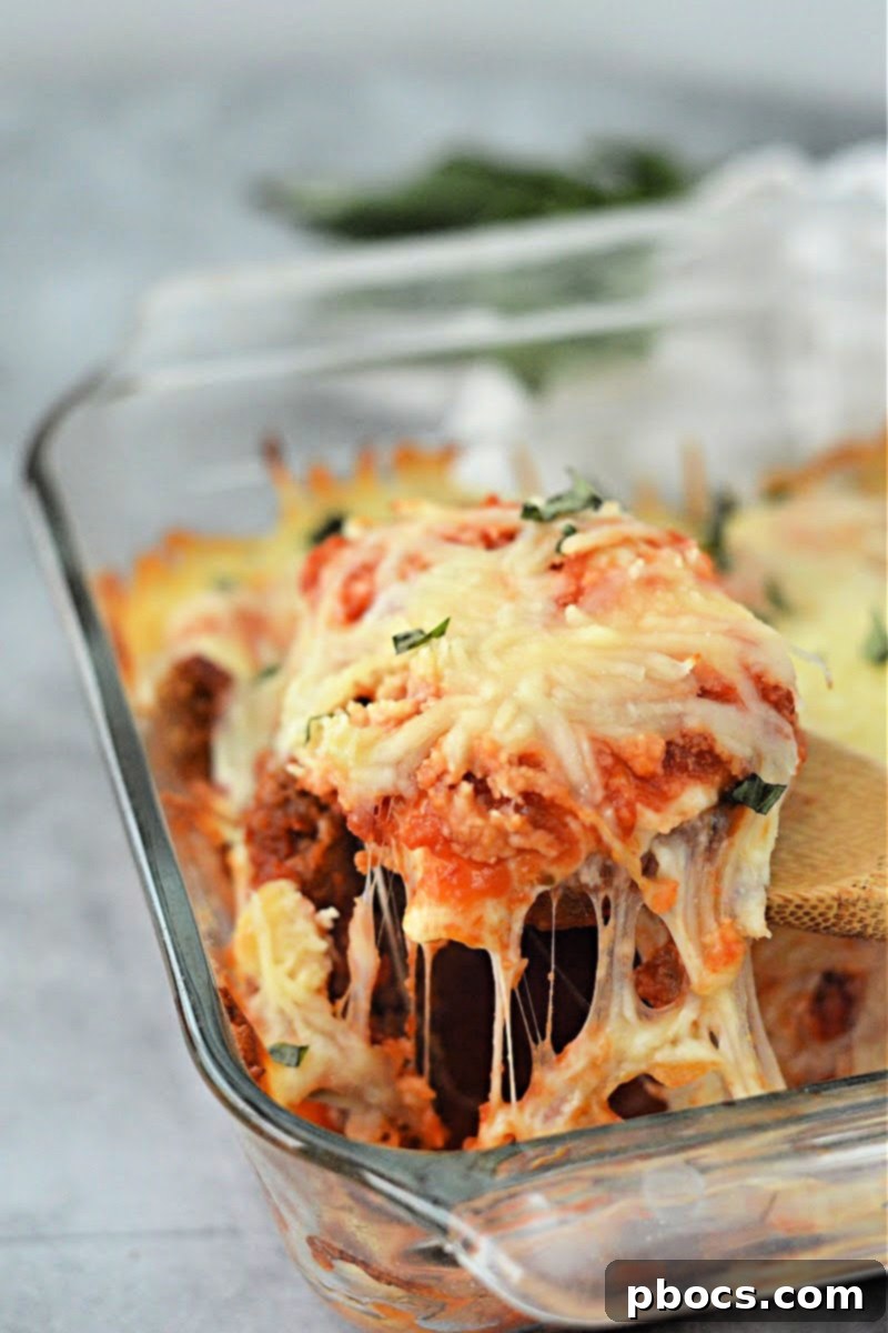 Keto Chicken Parmesan Nugget Bake 3 Close-up of bubbling Keto Chicken Nugget Parmesan Casserole fresh from the oven