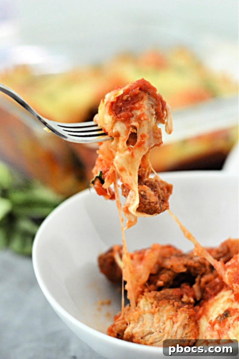 Keto Chicken Parmesan Nugget Bake 6 A serving of Keto Chicken Nugget Parmesan Casserole on a plate with side dishes