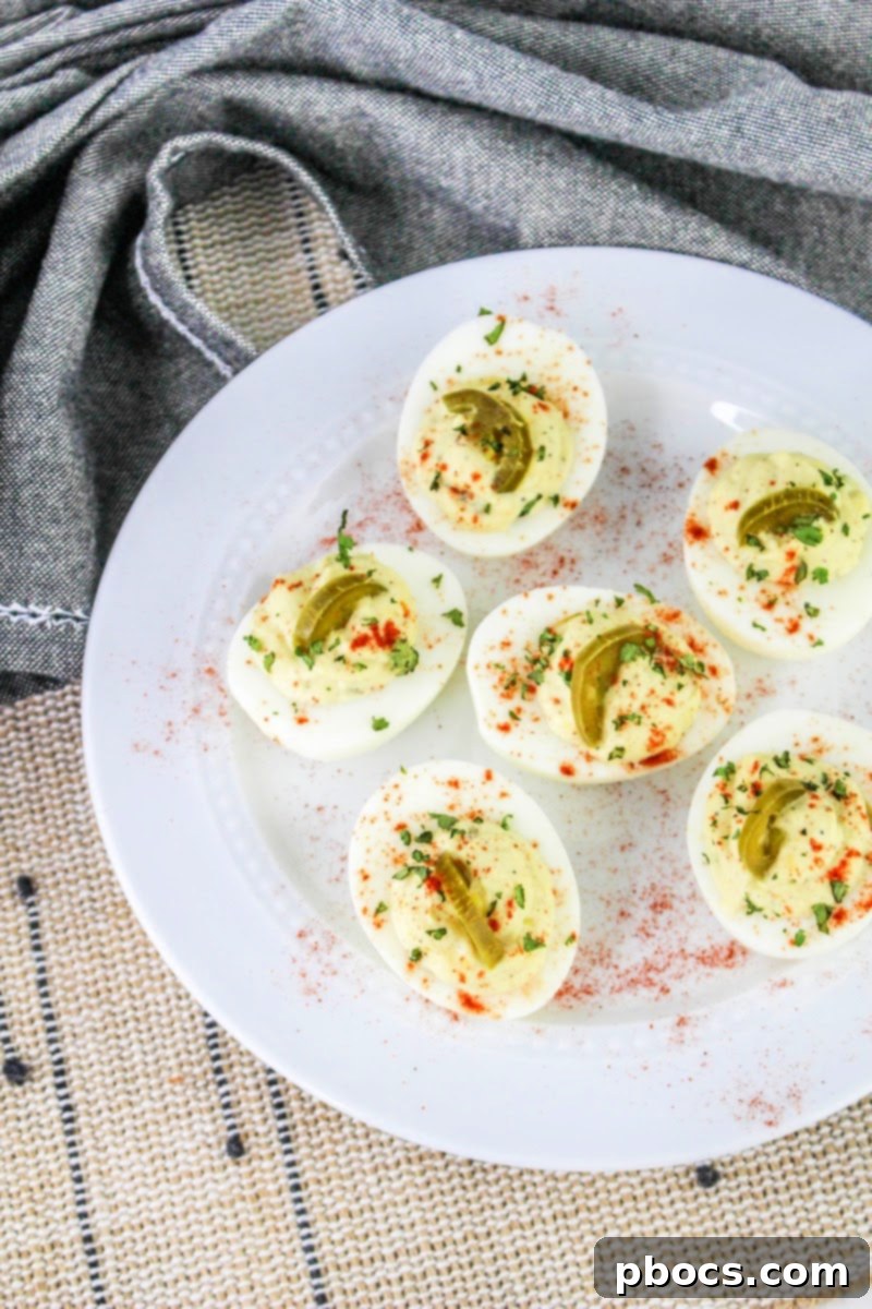Bowl of spicy deviled egg filling with chopped jalapenos