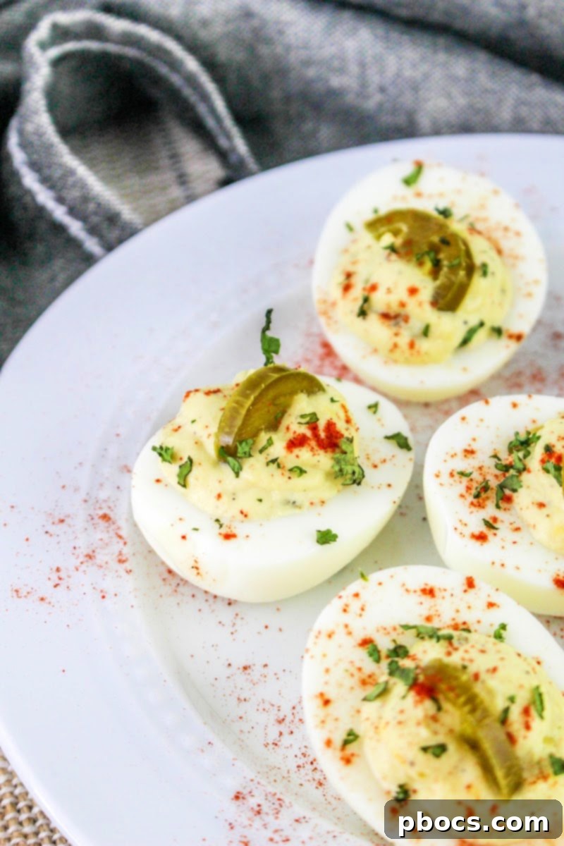 A plate of Keto Jalapeno Deviled Eggs with side dishes