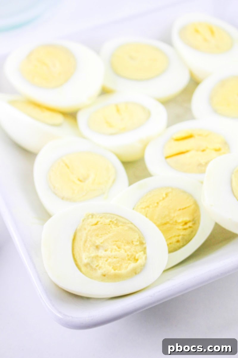 Hard Boiled Eggs sliced in half, showing yolks