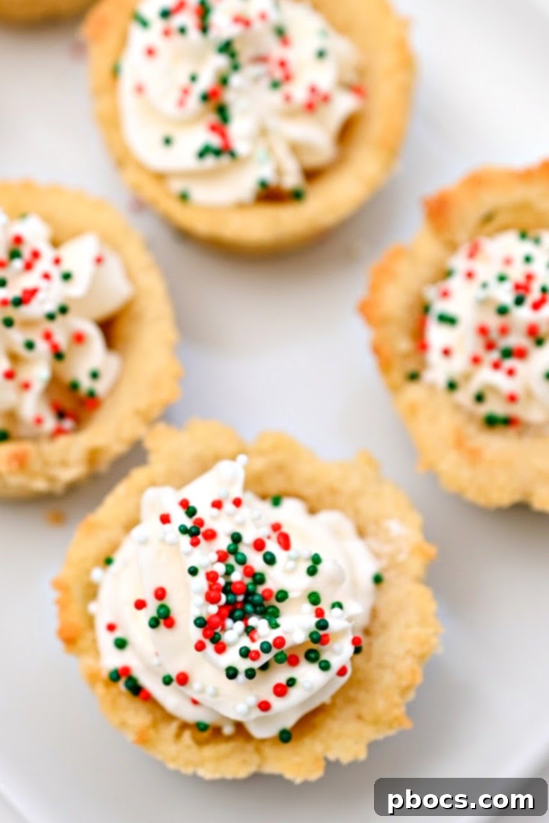 Festive Keto Christmas Cookie Cups filled with creamy frosting