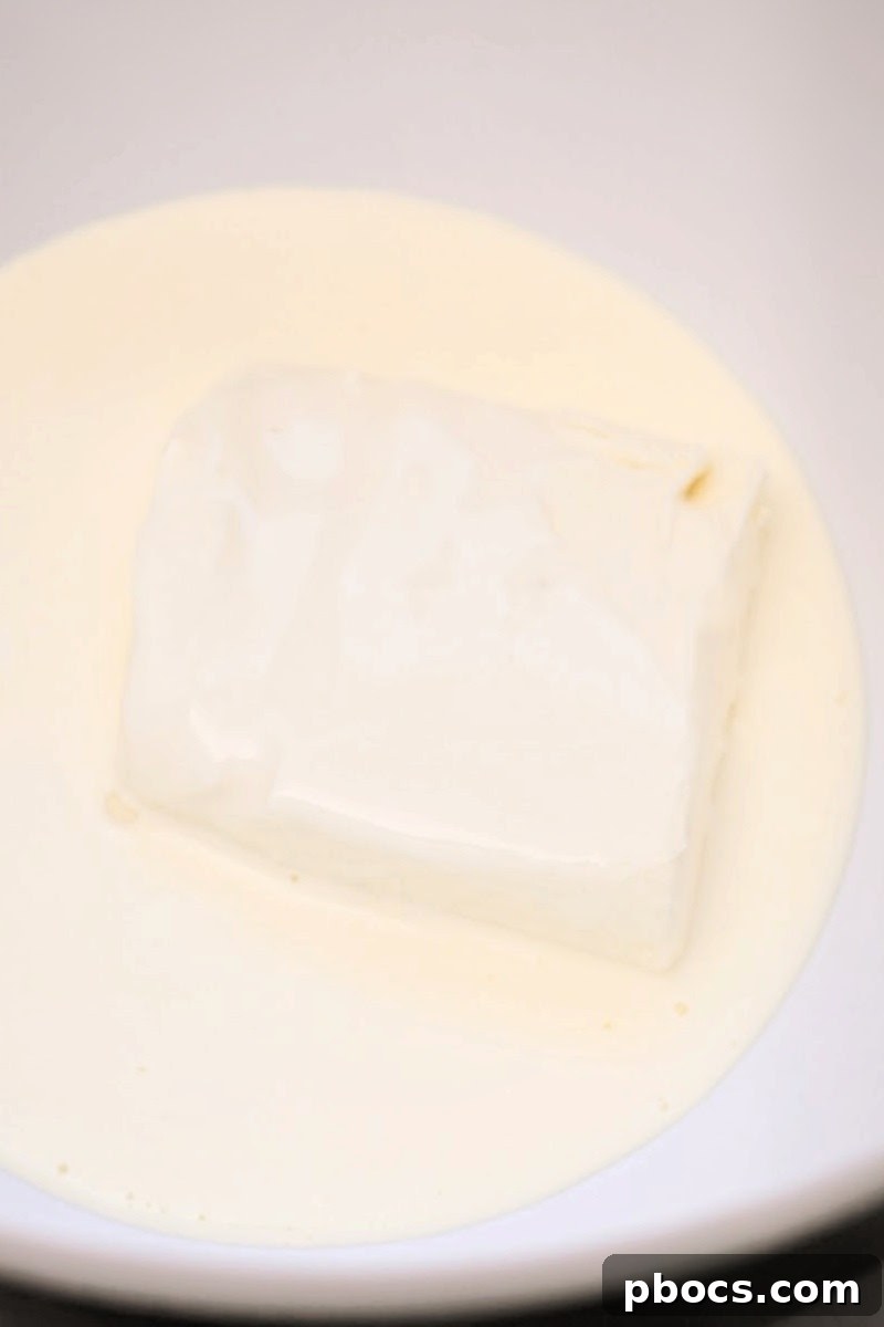 Preparing the creamy Keto cream cheese frosting