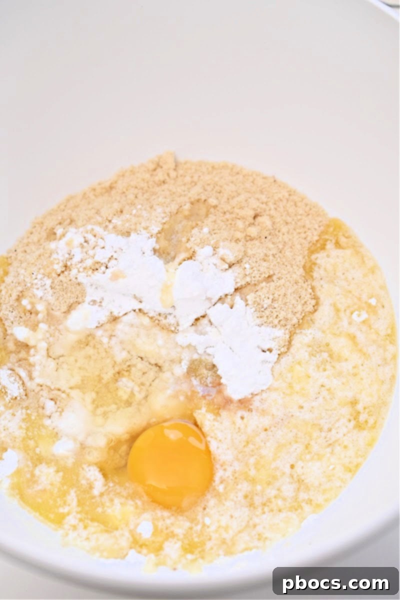 Mixing the ingredients for Keto Christmas Cookie Cups dough