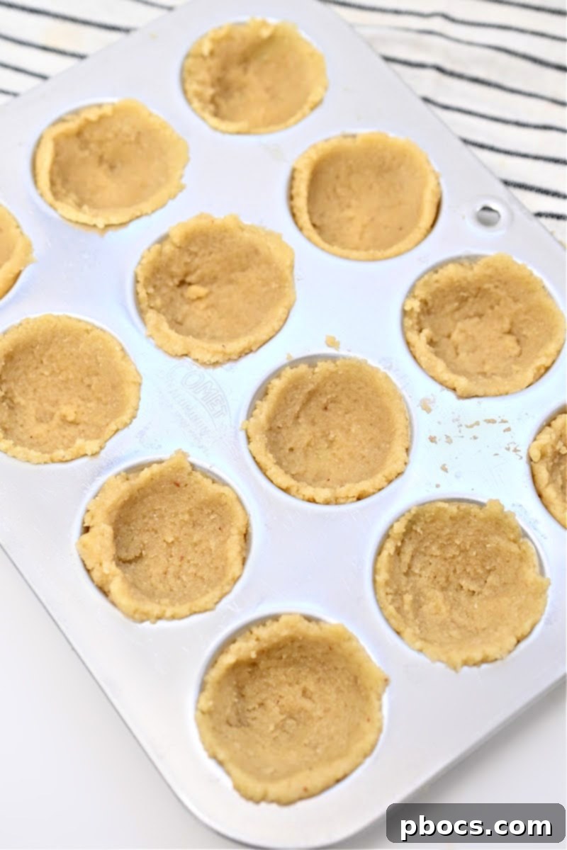 Baked Keto Christmas Cookie Cups cooling in the muffin tin