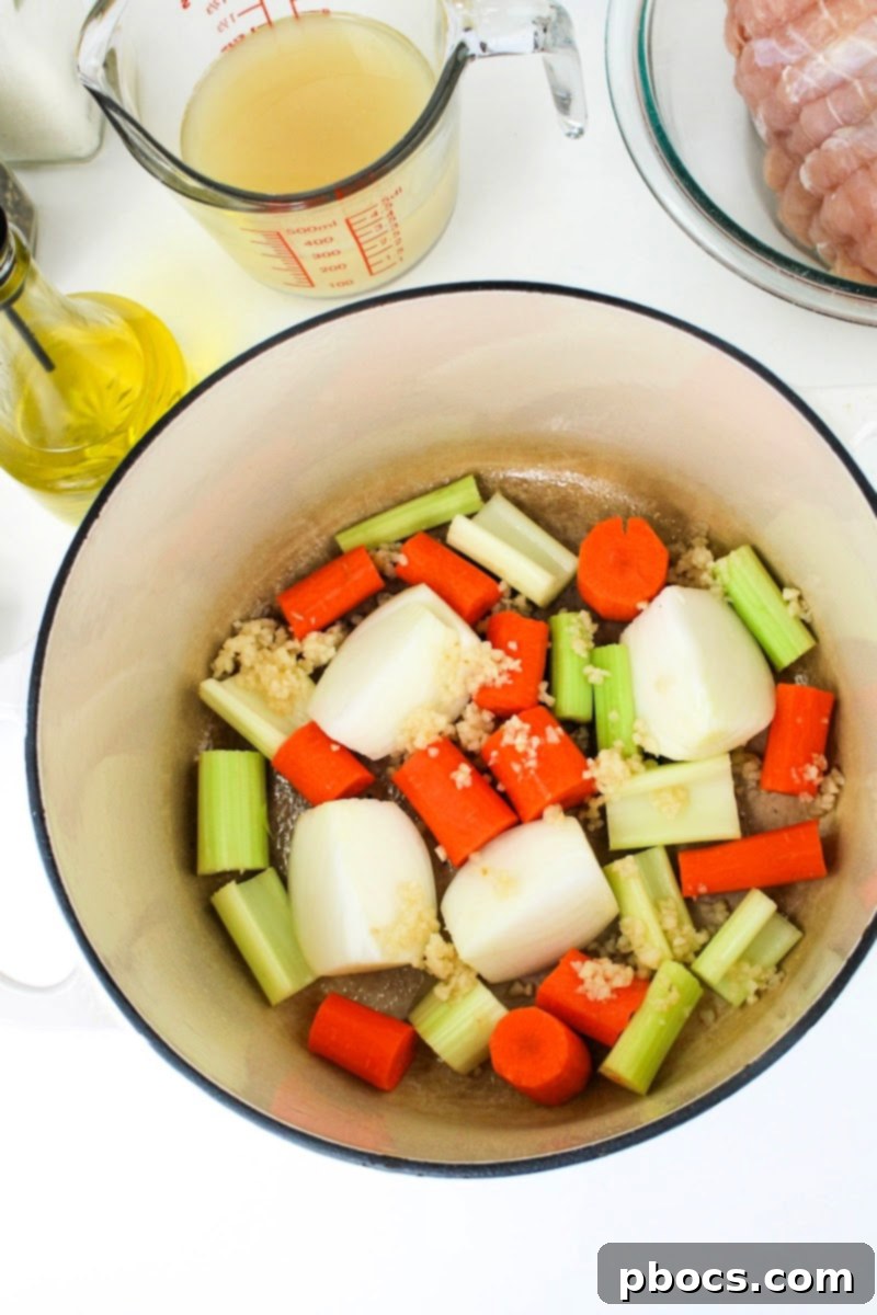 Adding vegetables to the dutch oven for turkey breast